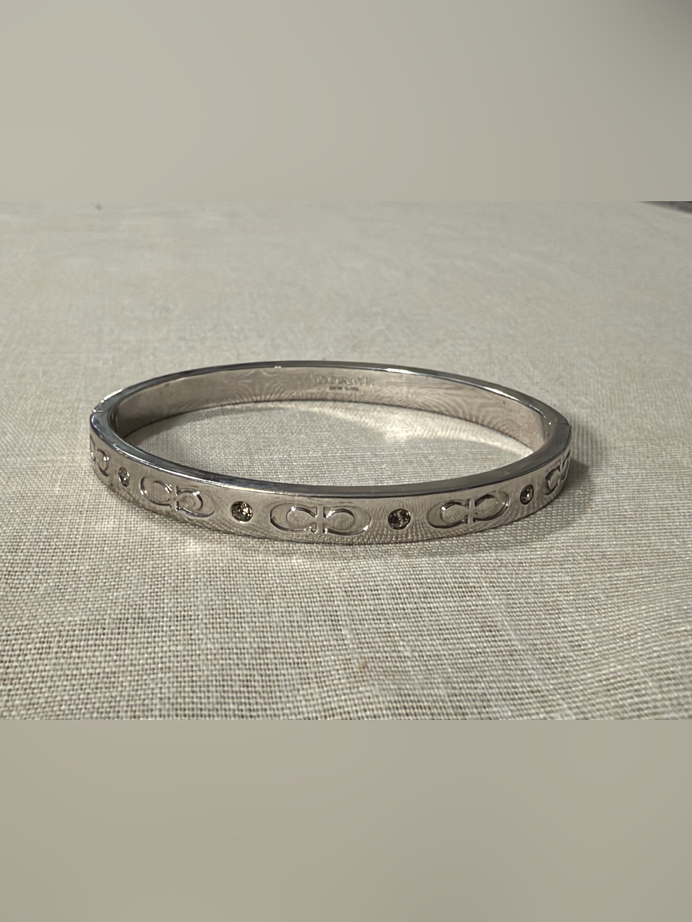 Coach Silver-Tone Logo and Crystal Hinged Bangle Bracelet Kissing C